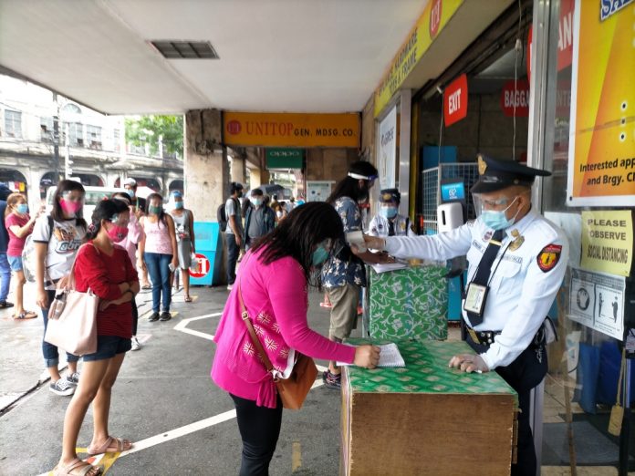 Customers Fill out a Declaration Form Before entering business establishments such as this one in Iloilo City, customers have to fill out a health declaration form. They must also submit to a body temperature check and observe physical distancing (at least one meter) while queuing. IAN PAUL CORDERO/PN