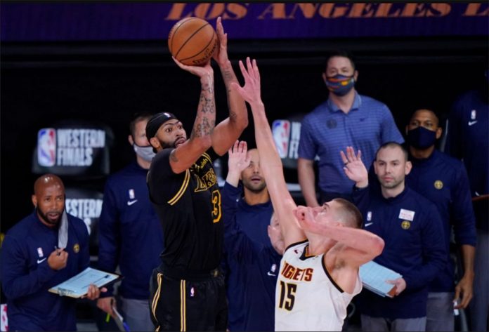 nba Los Angeles Lakers’ Anthony Davis drains a game-winning triple over Denver Nuggets’ Nikola Jokić in Game 2 of their Western Conference finals on Sunday in Lake Buena Vista, Florida. PHOTO COURTESY OF MARK TERILL/AP