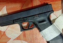 RECOVERED The Glock pistol issued to the late police chief of Guihulngan City, Negros Oriental, Superintendent Arnel Arpon, was recovered from a suspected New People’s Army leader who was arrested in a joint military and police operation on Sept. 20.