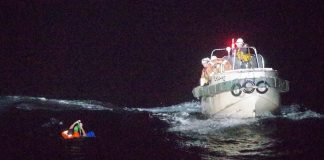 In this photo released by the 10th Regional Japan Coast Guard Headquarters, a Filipino crewmember of a Panamanian cargo ship is being rescued in the waters off Amami Oshima, Japan on Sept. 2, 2020. Dozens of crew members and nearly 6,000 cows are believed lost at sea after a livestock ship capsized in the East China Sea. THE 10TH REGIONAL JAPAN COAST GUARD HEADQUARTERS VIA AP