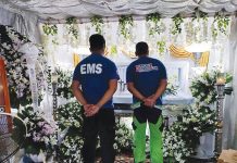 Members of the Municipal Disaster Risk Reduction and Management Office of Sigma, Capiz pay last respects to their coworker Ernie Fulgencio who died in a road accident on Sept. 7. SIGMA LGU