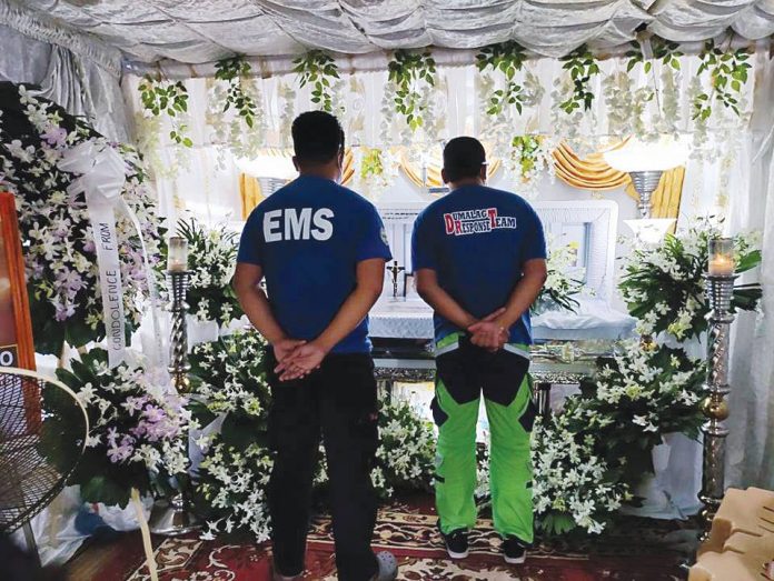 sigma lgu Members of the Municipal Disaster Risk Reduction and Management Office of Sigma, Capiz pay last respects to their coworker Ernie Fulgencio who died in a road accident on Sept. 7. SIGMA LGU