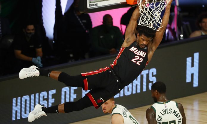 USP NBA: PLAYOFFS-MIAMI HEAT AT MILWAUKEE BUCKS S BKN MIL MIA USA FL Jimmy Butler jams the ball during Game 1 of Miami Heat’s Eastern Conference semifinal series versus Milwaukee Bucks on Monday night. Heat prevailed over the Eastern Conference top-seeded team, 115-104. USA TODAY FTW