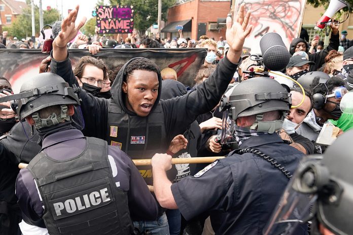protesters errupt over breanna taylor shooting A protester clashes with police after a grand jury considering the March killing of Breonna Taylor, a Black medical worker, in her home in Louisville, Kentucky. BRYAN WOOLSTON/REUTERS