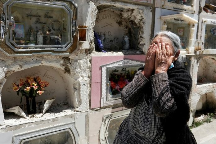 A woman reacts next to the grave of her husband as the General Cemetery was reopened for visitors in La Paz, Bolivia. DAVID MERCADO, REUTERS A woman reacts next to the grave of her husband as the General Cemetery was reopened for visitors in La Paz, Bolivia. DAVID MERCADO, REUTERS