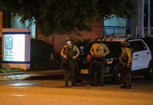 Search continues for gunman who shot California deputies Los Angeles County Sheriff’s deputies guard the entrance to St. Francis Medical Center early Monday, Sept. 13, 2020, after two deputies were shot late Saturday, Sept. 12 while sitting inside their patrol vehicle guarding a Metro station in Compton, California. JINTAK HAN/AP PHOTO