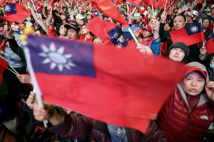 Taiwan Supporters of Kuomintang party’s presidential candidate Han Kuo-yu wave Taiwanese flags during an election rally in Taipei, Taiwan. ANN WANG, REUTERS/FILE