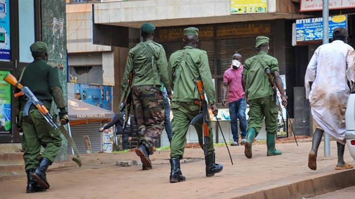 Prisoners in a Ugandan jail overpowered their guards and 219 of them escaped with at least 15 guns. RONALD KABUUBI/AP