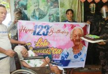 Policemen in Kabankalan City, Negros Occidental led by Lieutenant Colonel Mary Rose Pico (right) greet Francisca Montes-Susano, who turned 123 years old on Sept. 11, 2020 at her residence in Barangay Oringao. The super-centenarian was tagged the oldest living Filipino and could also be the world’s oldest once her birth records are verified. KABANKALAN CITY POLICE STATION