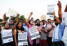 Demonstrators protest after the death of a rape victim, on Rajpath near India Gate, in New Delhi, India, Sept. 30, 2020. REUTERS