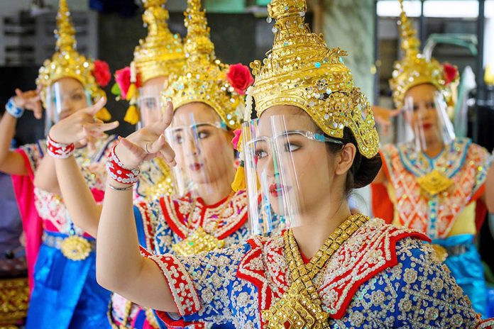 Thailand Traditional Thai dancers wearing protective face shields perform at the Erawan Shrine, which was reopened after the Thai government relaxed measures to combat the spread of the novel coronavirus, in Bangkok on May 4, 2020. AFP