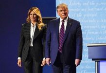 President Donald Trump stands on stage with first lady Melania Trump after the first presidential debate with Democratic presidential candidate former Vice President Joe Biden on Sept. 29, 2020, at Case Western University and Cleveland Clinic, in Cleveland, Ohio. Trump and his first lady have tested positive for the coronavirus, the president tweeted early Friday. AP