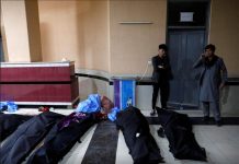 Afghan men look for their relatives at a hospital after a suicide bombing in Kabul, Afghanistan on Oct. 24, 2020. REUTERS