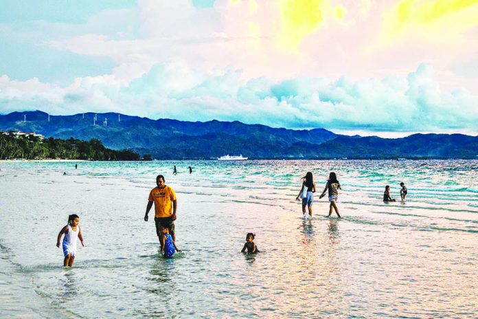 boracay Several tourists are spotted in the waters of Boracay Island in Malay, Aklan days after its re-opening on Oct. 1. The famed-island resort was shut down for four months due to the coronavirus pandemic. EZRA ACAYAN/GETTY IMAGES