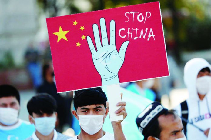 china_C Ethnic Uighur demonstrators take part in a protest against China, in Istanbul, Turkey Oct. 1, 2020. MURAD SEZER/REUTERS