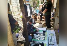Antidrug operatives conduct an inventory of the suspected illegal drugs seized in a drug den in Barangay 6, San Carlos City, Negros Occidental. PDEA-6