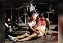 A concerned citizen comes to the rescue of this bloodied fish vendor shot by a still unidentified assailant in Barangay District 3, Sibalom, Antique. PHOTO FROM FACEBOOK