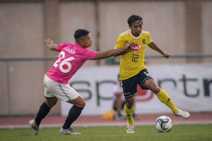 football Negrense Jayson Panhay (yellow) broke the ice for Kaya Futbol Club-Iloilo via conversion that hit the back of the net at the 30th minute mark. KAYA ILOILO FILE PHOTO
