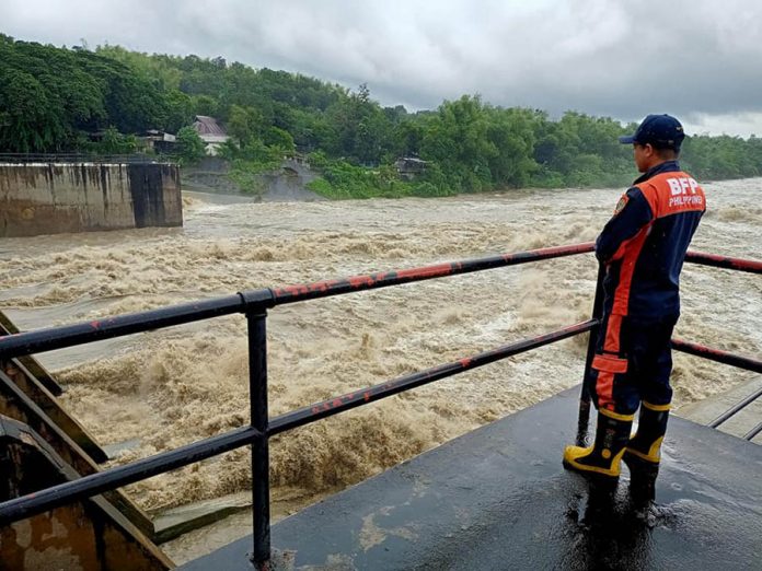 front pic Personnel of the Bureau of Fire Protection monitors the Jalaur Diversion Irrigation Dam in Barangay Moroboro, Dingle, Iloilo on Monday, Oct. 26, 2020. The dam’s water level rose due to rainfall dumped by Typhoon “Quinta". BFP-DINGLE