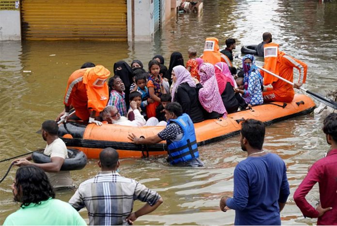 india Residents are evacuated from a flooded neighborhood after heavy rainfall in Hyderabad, the capital of the southern state of Telangana, India on Oct. 15, 2020. VINOD BABU/REUTERS