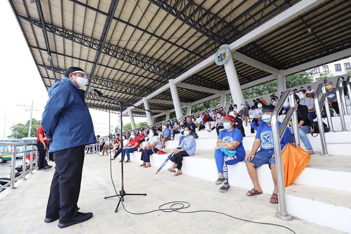 Mayor Jerry Treñas of Iloilo City (standing) addresses village heads at the Iloilo City Freedom Grandstand on Sept 29. The city government is deputizing barangay officials to enforce minimum health standards to curb the spread of coronavirus disease. ARNOLD ALMACEN/CMO