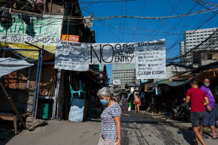 nation Various quarantine reminders are seen hanging at the entrance of this village. The OCTA research team earlier published a COVID-19 monitoring report, which laid out suggestions for stricter quarantine rules for emerging virus hotspots in the country. PHOTO COURTESY OF KIMBERLY DELA CRUZ/ABC NEWS