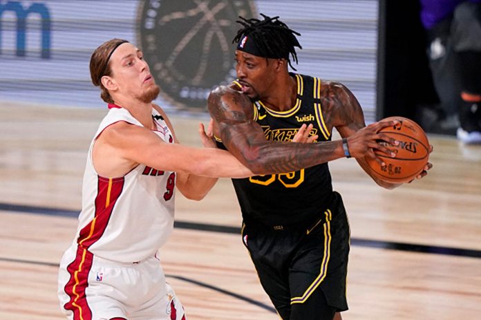 Los Angeles Lakers’ Dwight Howard protects the ball from Miami Heat big man Kelly Olynyk. AP PHOTO
