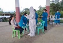 Passi city hall shuts down; 16 employees infected Health personnel collect specimens from an employee of Passi City government during a pooled testing for coronavirus disease 2019. The Passi city hall is closing its doors to the public for three days due to rising of infections. PASSI CITY PIO
