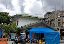 Coronavirus hits 6 frontliners in Oton A tricycle passes by a barricaded headquarters of the Municipal Disaster Risk Reduction and Management Office in Oton, Iloilo. Six of the agency’s personnel contracted coronavirus. PANAY NEWS