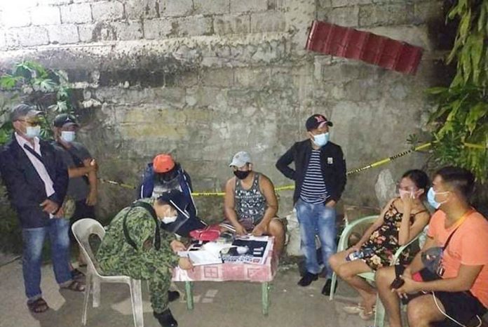 news ruby drugs Antidrug operatives conduct an inventory of illegal drugs seized from Eliza May Malfarta (second from right) and Distin Jay Garvelles (fourth from left) in a buy-bust in Zone 3, Barangay Boulevard, Molo, Iloilo City on Oct. 19, 2020. PRO-6