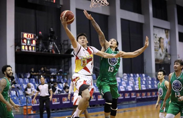 pba Ilonggo Paul Zamar of San Miguel Beermen blows past the defense of TerraFirma Dyip’s Jeepy Faundo for a layup. PBA PHOTO