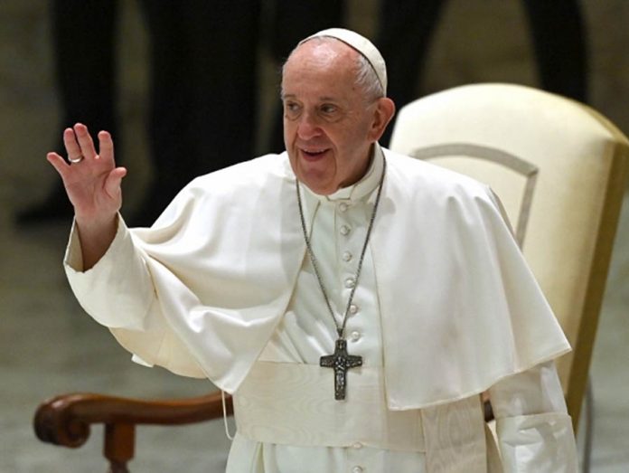 pope Pope Francis waves during his weekly general audience in the Paul VI hall at the Vatican on Oct. 14, 2020. ALBERTO PIZZOLI/AFP