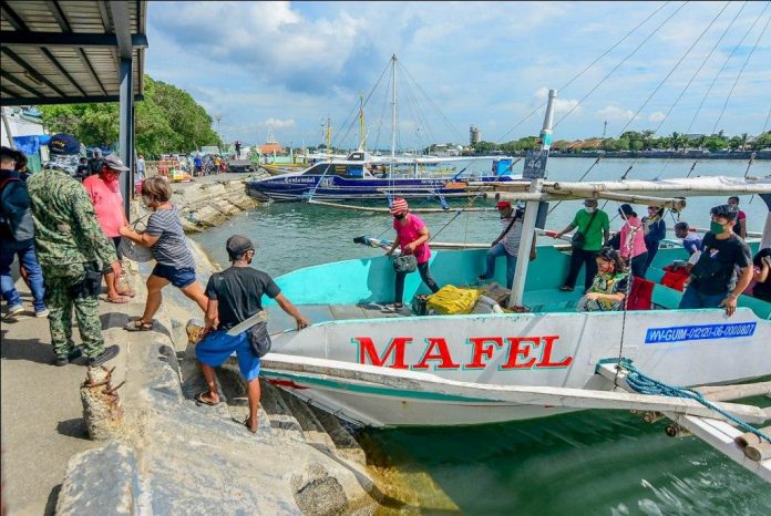 region guimaras wooden boats pic A wooden-hulled motorboat from Guimaras Island docks at the Iloilo Ferry Terminal-Parola Wharf in Iloilo City. Wooden-hulled motorboats plying the Guimaras-Iloilo route and vice versa can still operate until December 2020. IAN PAUL CORDERO/PN