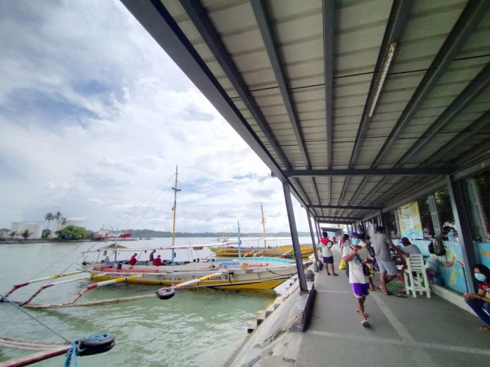 region rapid test story pic These motorboats at the Iloilo Ferry Terminal-Parola in Iloilo City are waiting for passengers bound for the island province of Guimaras. The Guimaras provincial government has put on hold its plan to subject to rapid coronavirus test all people entering the island province. IAN PAUL CORDERO/PN