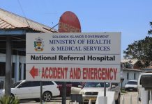 A road sign points the way to emergency services in Solomon Islands. WORLD BANK