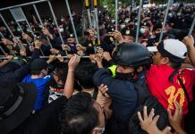 Pro-democracy protesters push back Thai police during an anti-government demonstration in Bangkok, Thailand on Oct. 14, 2020. ANADOLU AGENCY