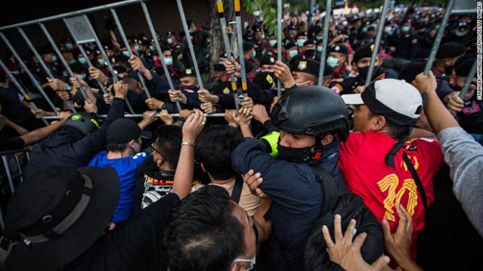 thai Pro-democracy protesters push back Thai police during an anti-government demonstration in Bangkok, Thailand on Oct. 14, 2020. ANADOLU AGENCY