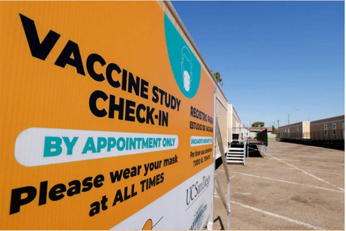 vaccine Signs directing arriving patients are shown at a trailer compound after a Phase 3 trial location of Johnson & Johnson’s Janssen vaccine candidate was announced in National City, California, US. MIKE BLAKE, REUTERS