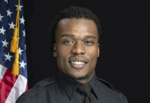This undated photo provided by the Wauwatosa Police Department in Wauwatosa, Wis., shows Wauwatosa Police Officer Joseph Mensah. GARY MONREAL/MONREAL PHOTOGRAPHY LLC/WAUWATOSA POLICE DEPARTMENT VIA AP