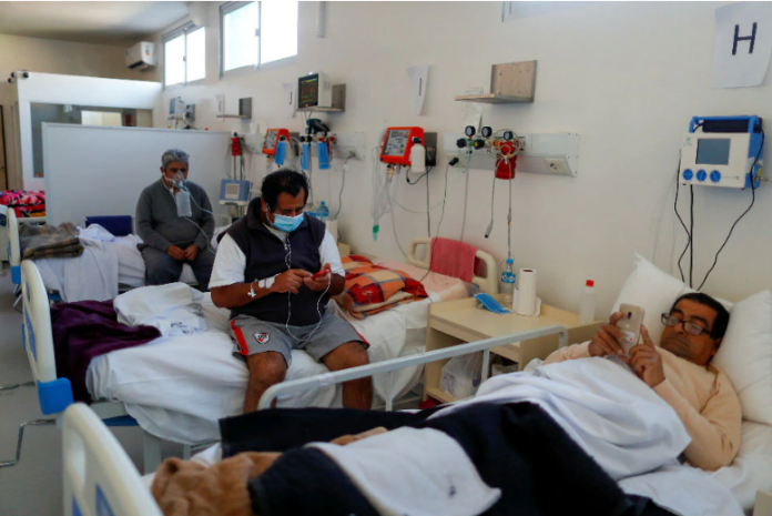COVID patients, rest in their beds in an Intensive Care Unit at the Dr. Alberto Antranik Eurnekian hospital in Buenos Aires, Argentina. AGUSTIN MARCARIAN/REUTERS