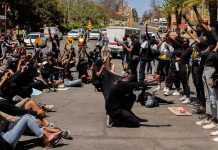 Anti-femicide protesters call for a state of emergency in Namibia Protesters hold placards during the second day of the #ShutItDown Protests in Windhoek’s Central Business District on Oct. 9, 2020. AFP PHOTO