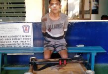 Man nabbed for ‘stealing’ guard’s gun Raymark Hilado, 22, sits handcuffed inside the headquarters of Police Station 8 in Bacolod City on Thursday. Hilado was accused of stealing a security guard’s service firearm. POLICE STATION 8