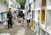 A police officer makes sure visitors at the public cemetery in Arevalo, Iloilo City follow public health protocols such as wearing facemasks on Oct. 27, days before the weeklong closure of cemeteries nationwide. This year’s All Saints’ Day and All Souls’ Day were generally peaceful, according to the Police Regional Office 6. IAN PAUL CORDERO/PN