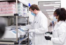 Moderna vaccine results ‘stunningly impressive,’ says Fauci Researchers work in a lab run by Moderna Inc, who said Nov. 16, 2020 that its experimental vaccine was 94.5 percent effective in preventing COVID-19 based on interim data from a late-stage clinical trial. MODERNA INC, HANDOUT/REUTERS