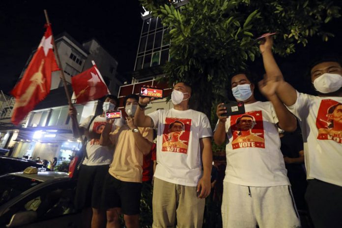 myanmar Supporters cheer as they gather in front of Myanmar Leader Aung San Suu Kyi’s headquarters during Election Day on Nov. 8, 2020 in Yangon, Myanmar. THEIN ZAW/AP PHOTO
