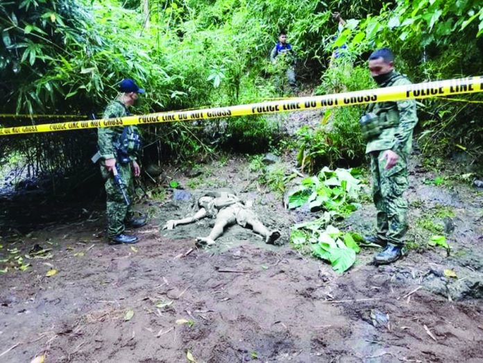 news dominique NPA Soldiers of the Philippine Army’s 62nd Infantry Battalion inspect the body of slain Rio Jacaba, an alleged member of the New People’s Army Yunit Militia based in central Negros. PH ARMY