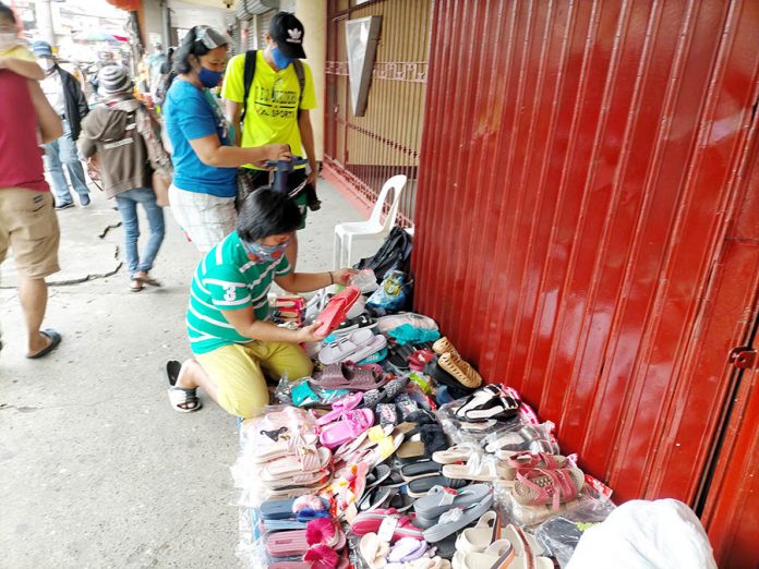 road clearing This vendor of plastic and rubber slippers on the sidewalk of Iznart Street, Iloilo City has to relocate elsewhere. The city government’s Public Safety and Transportation Management Office is again clearing the roads of obstruction starting Nov. 17. IAN PAUL CORDERO/PN