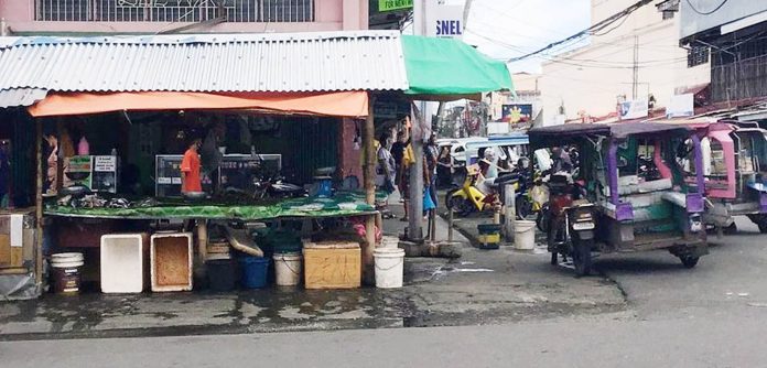 region kalibos talipapa Talipapa along barangay roads such as this one offers residents of Kalibo, Aklan the convenience to buy their daily household needs such as a variety of fresh produce. ROADSIDE CONVENIENCE