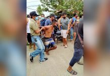 Roxas theft suspect falls NOWHERE TO RUN Barangay tanods and officials of Barangay Banica, Roxas City place under arrest this theft suspect whom a storeowner tagged as the one who tried to snatch her money and hit her head with a hammer. Joel Cordilla, the suspect, is a resident of Masbate province but temporarily residing in Roxas City. PHOTO BY REY BALMES