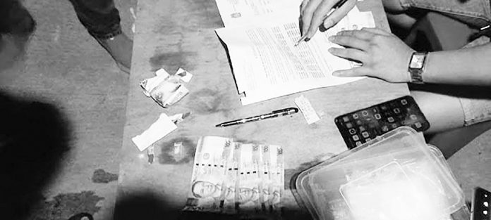 region zabal kalibo bust A police operative conducts an inventory of the items seized from drug suspect Alexis Barial Diangson in Kalibo, Aklan. PHOTO BY RODNEL AGUIRRE, RMN KALIBO
